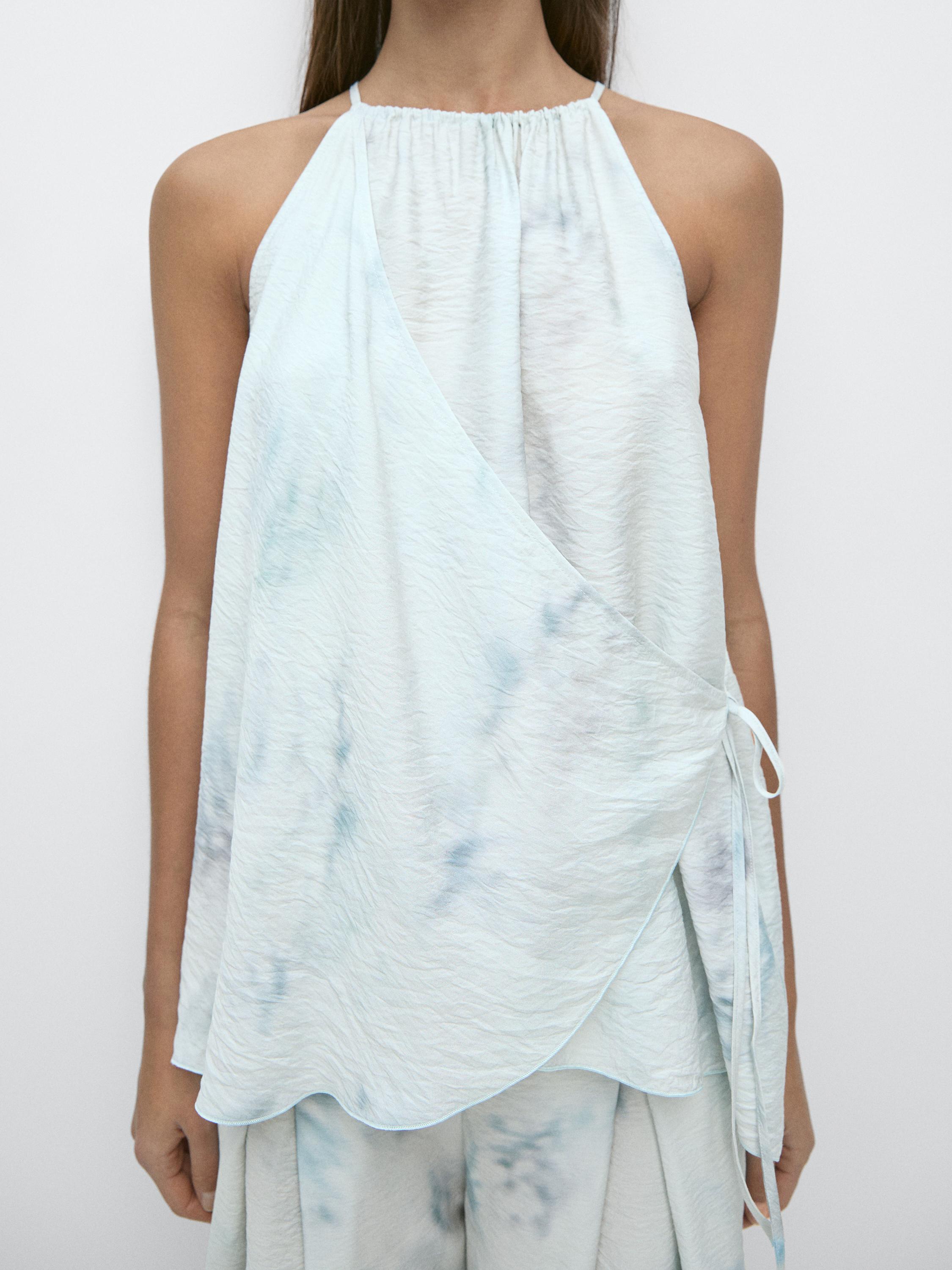 Flowing halterneck top with tie detail