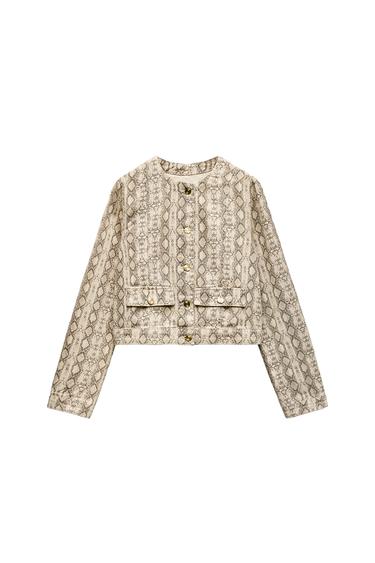 Front view of jacket with snake print and gold buttons.