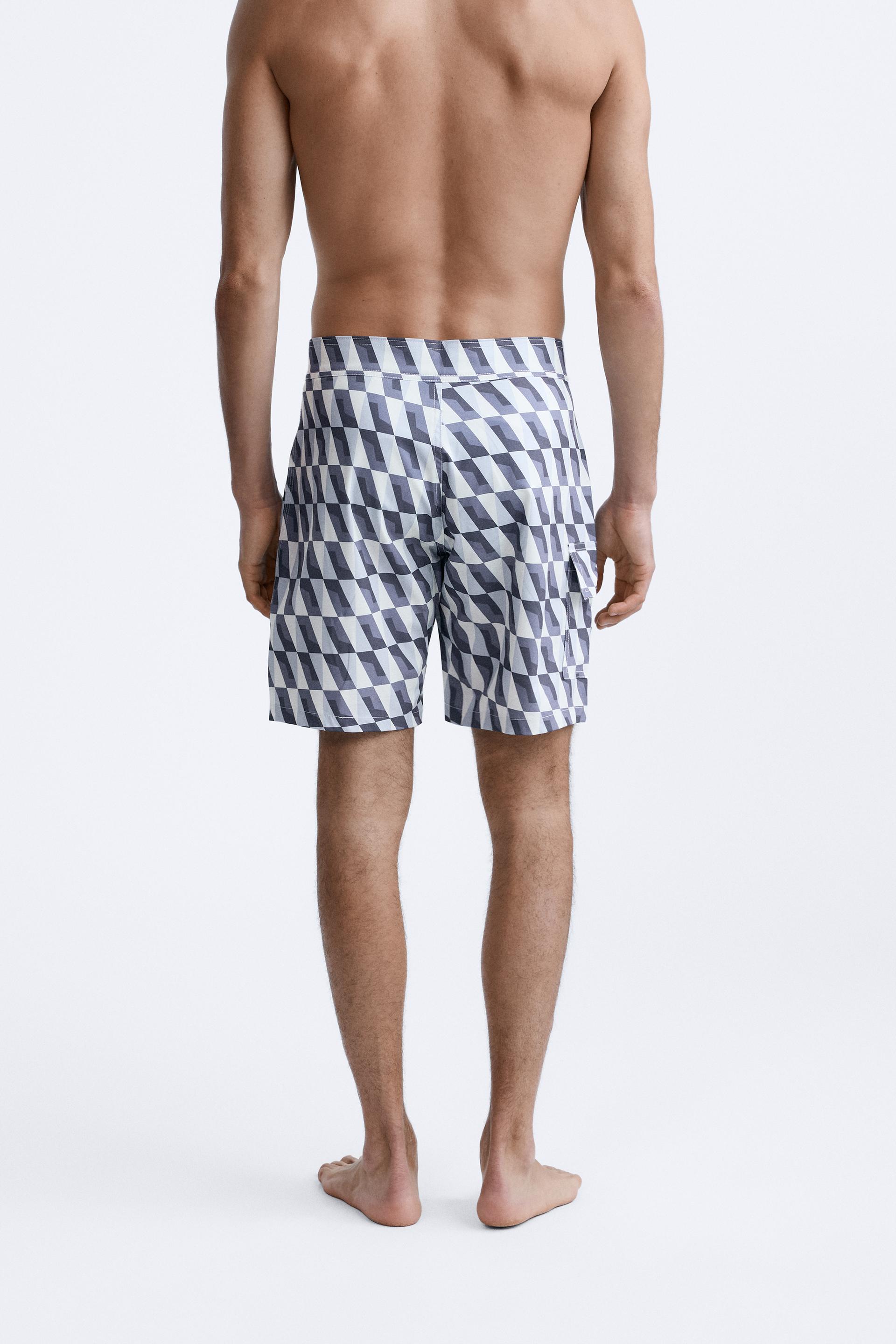 GEOMETRIC PRINT LONGLINE SWIMMING TRUNKS - Black