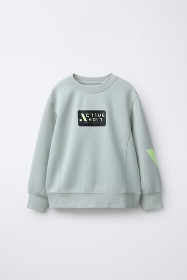 سويت شيرت طراز رياضي - رمادي فاتح الخاص بـ Zara