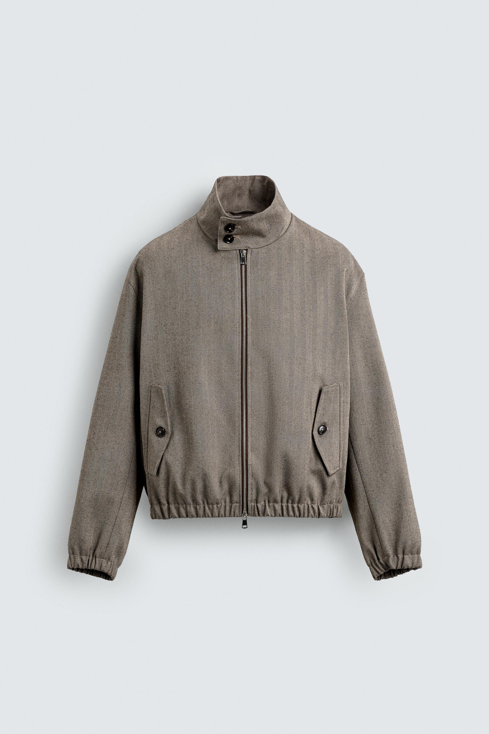 BLOUSON COURT COUPE STRUCTURÉE À CHEVRONS