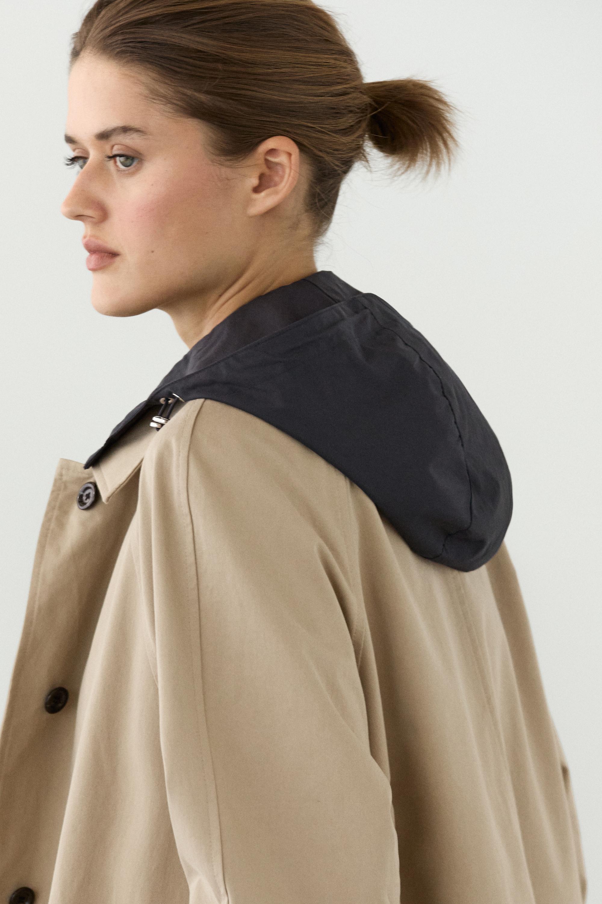 Cape trench coat with detachable hood