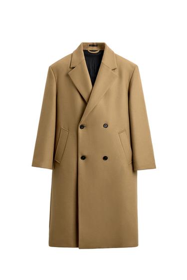 Front view of a toasted double-breasted coat with notched lapels, long sleeves, and hip-level jetted pockets.