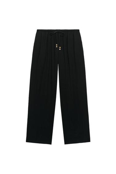 PANTALÓN TEXTURA LAZADA ABALORIOS - Negro de Zara