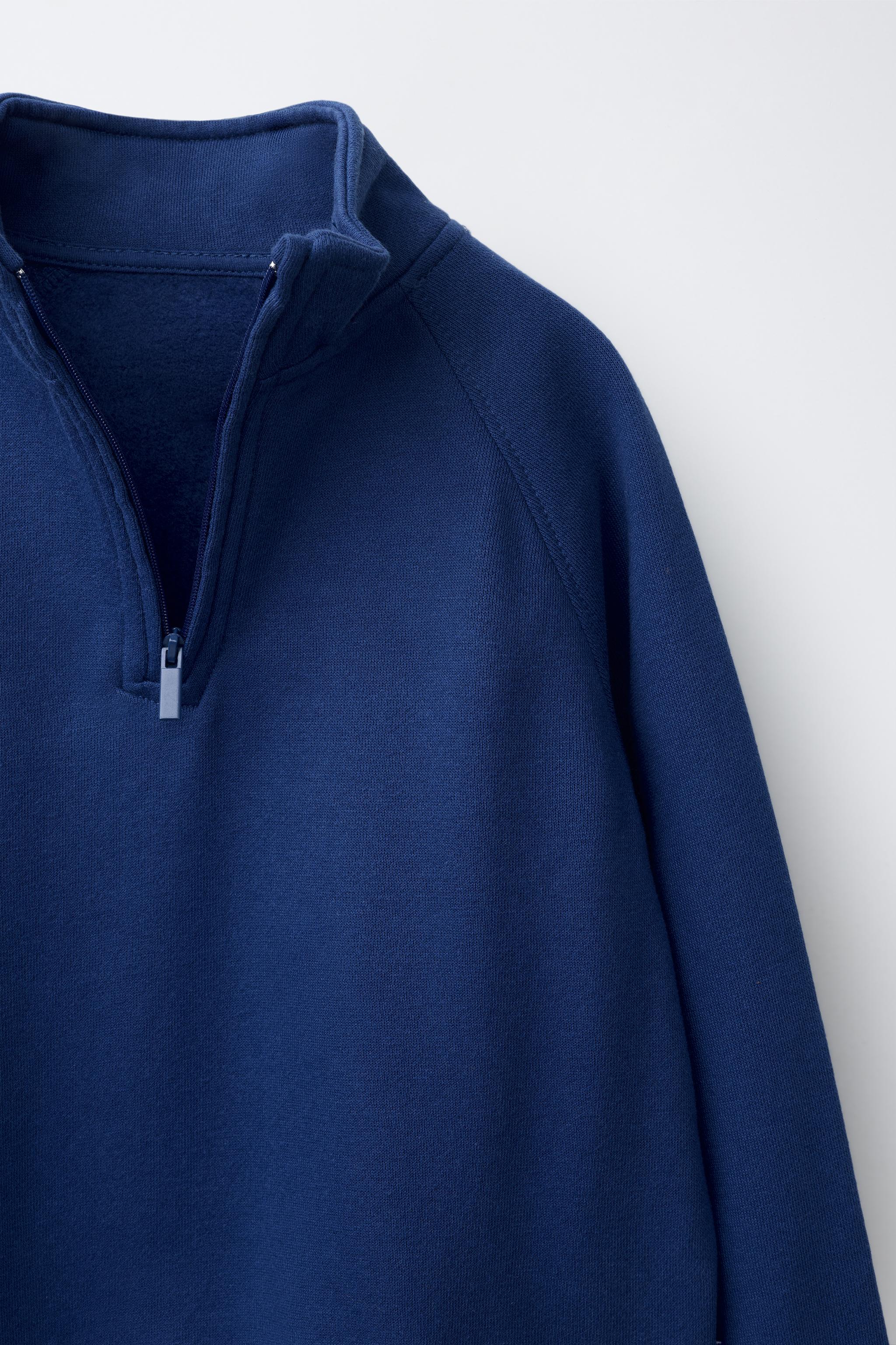 SWEAT UNI AVEC ÉTIQUETTE