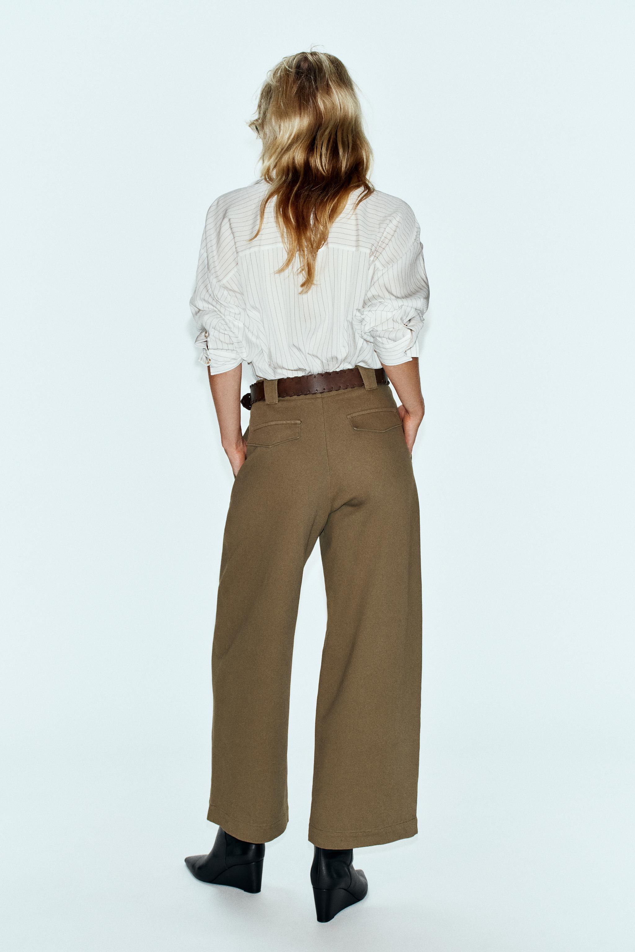WIDE-LEG PLEATED BELTED PANTS