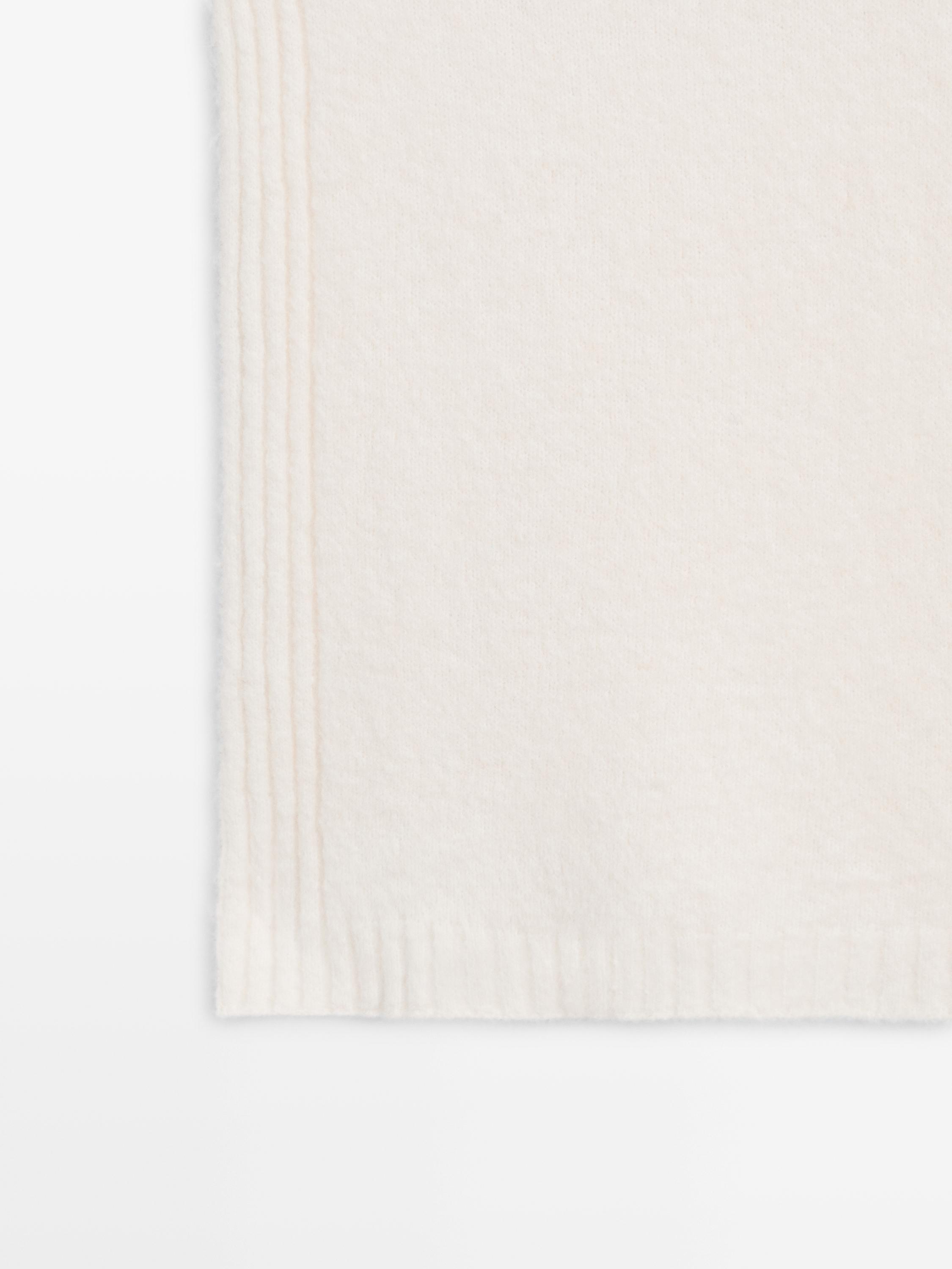 Sleeveless high neck sweater