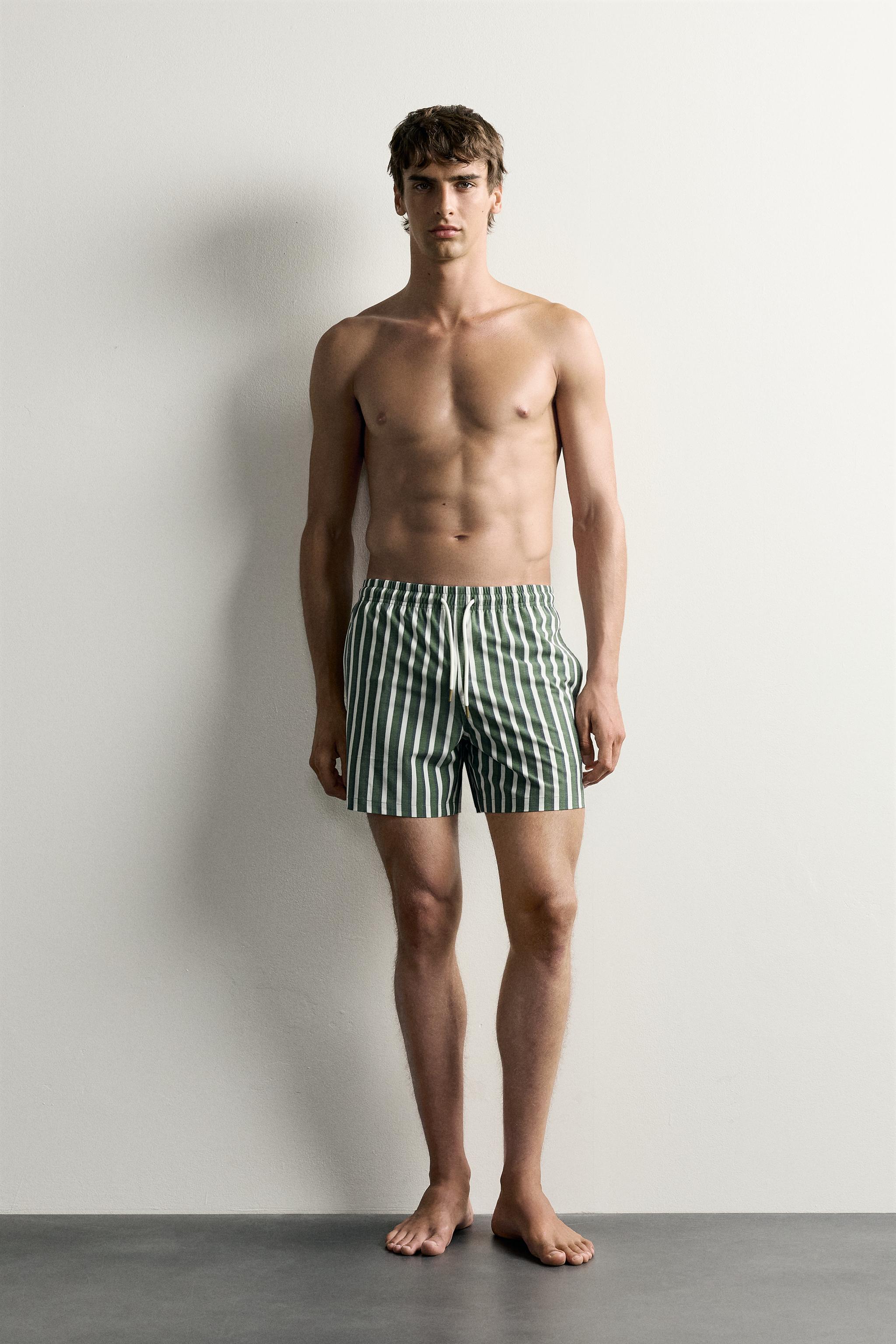 STRIPED MID-LENGTH SWIM SHORTS