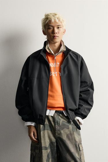 LIGHTWEIGHT WATER-REPELLENT TECHNICAL JACKET — Black 1