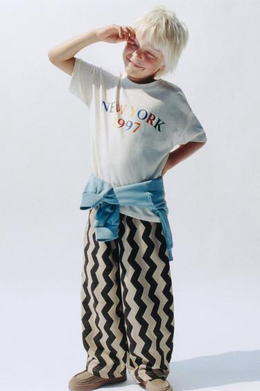 PANTALON BALLON EN MOLLETON À MOTIF VAGUES - Noir / Sable de Zara
