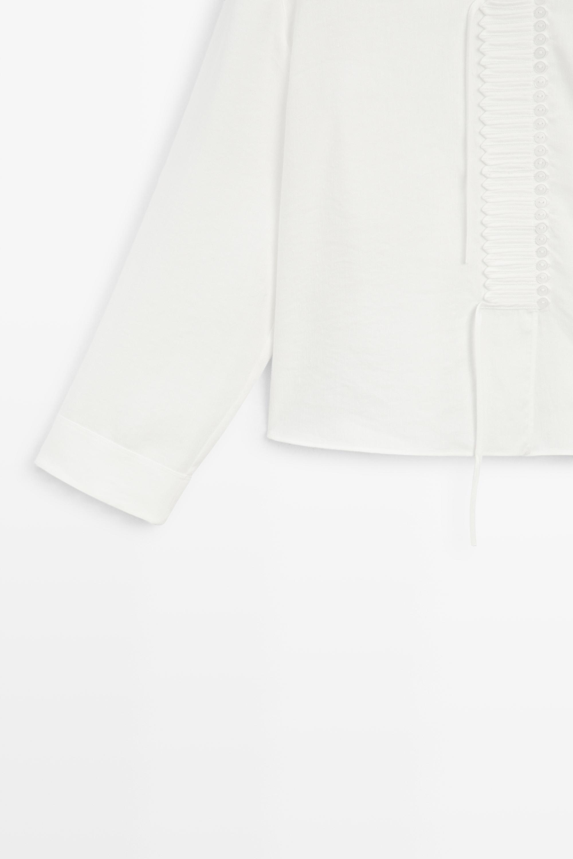 Flowing linen blend blouse with button detail