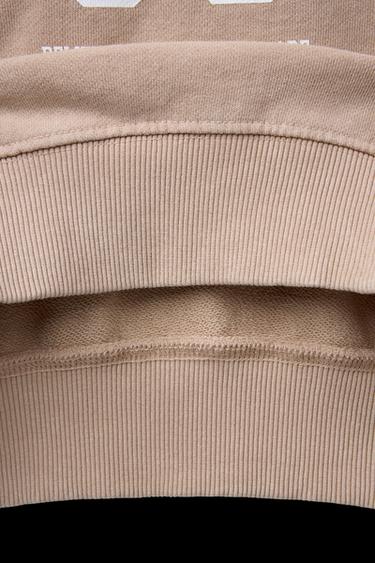 SUDADERA EFECTO LAVADO TEXTO - Beige de Zara