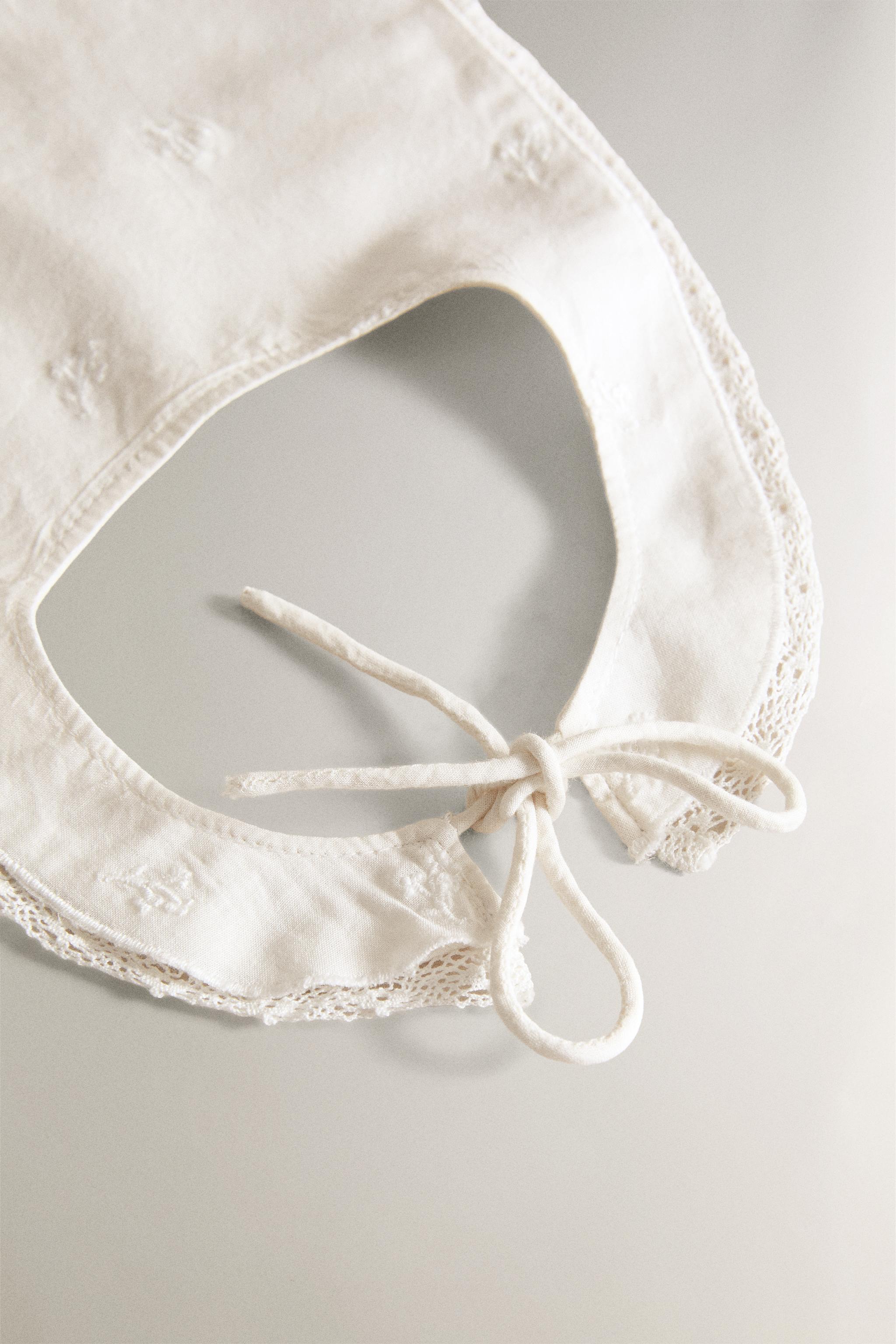 BABY BIB WITH FLORAL EMBROIDERY