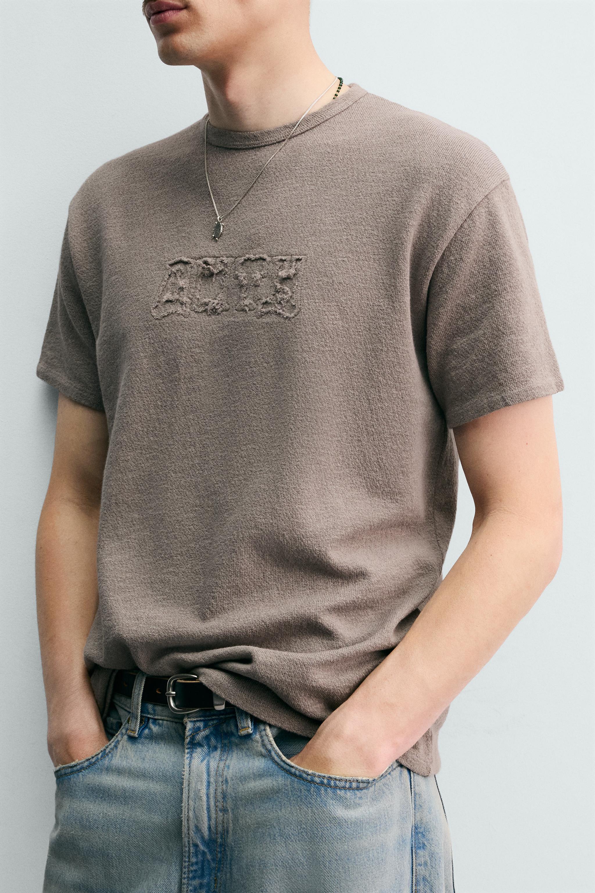 T-SHIRT EN MAILLE LAVÉE À PIÈCES