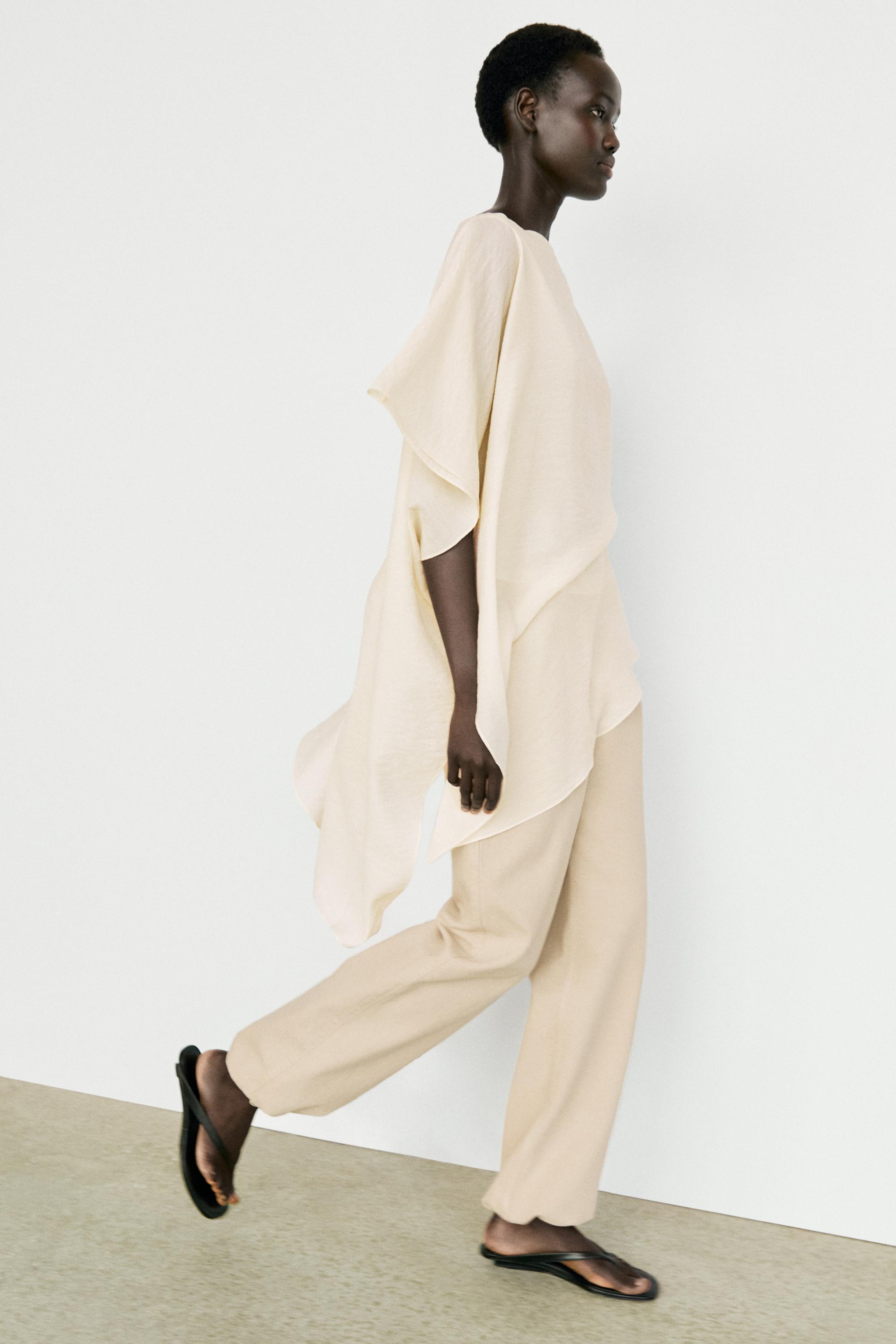 Blouse fluide asymétrique style cape