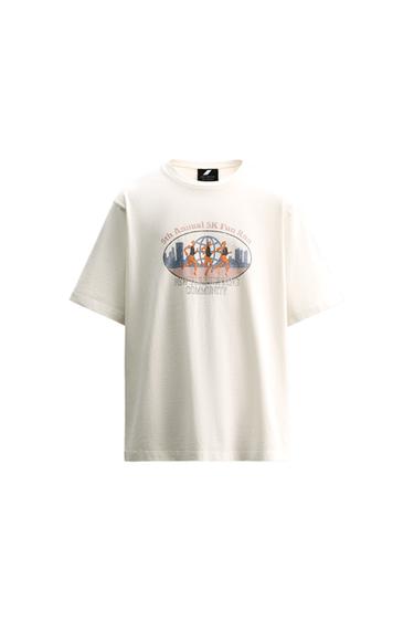 Front view of a white t-shirt with the text '5th Annual 5K Fun Run' and a graphic of runners in front of an urban silhouette.