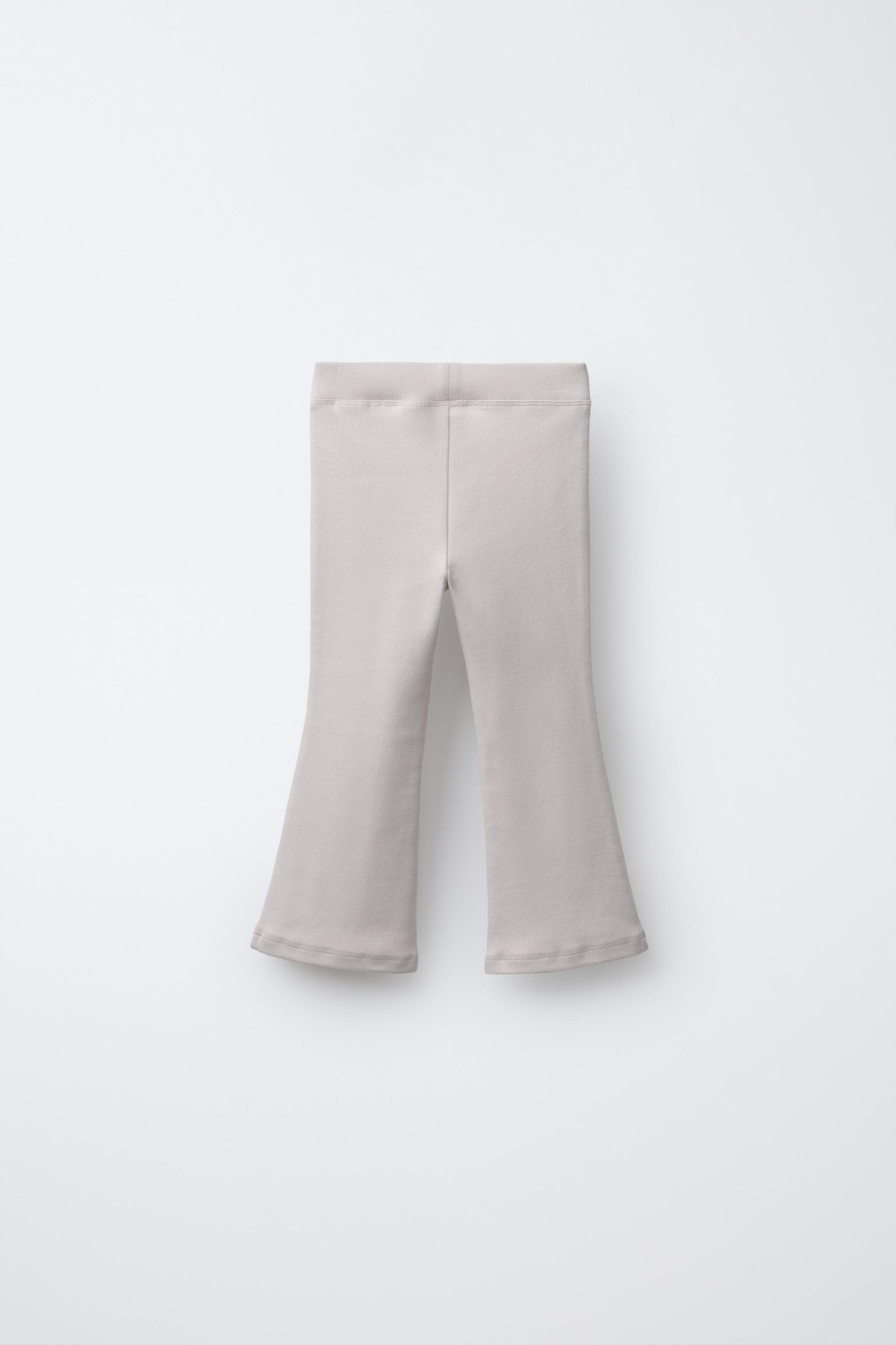 PANTALON EN MOLLETON FLARE À INSCRIPTION RELIEF