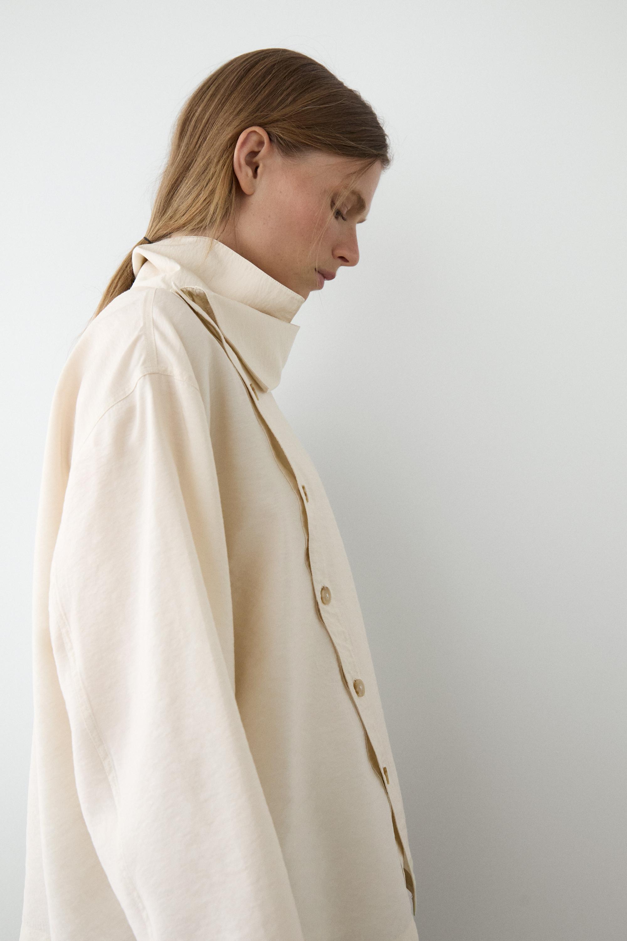 Flowing shirt with asymmetric buttons