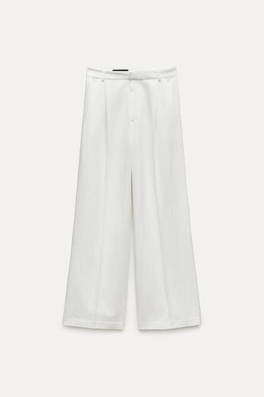 БРЮКИ ИЗ СТРУЯЩЕЙСЯ ТКАНИ СО СКЛАДКАМИ — ЭКРЮ от Zara — изображение 0