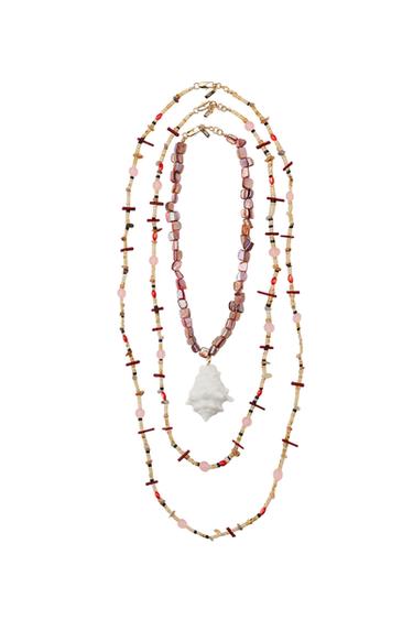 Pack of three necklaces with pink and red beaded details, one with a white shell pendant. Lobster clasps.