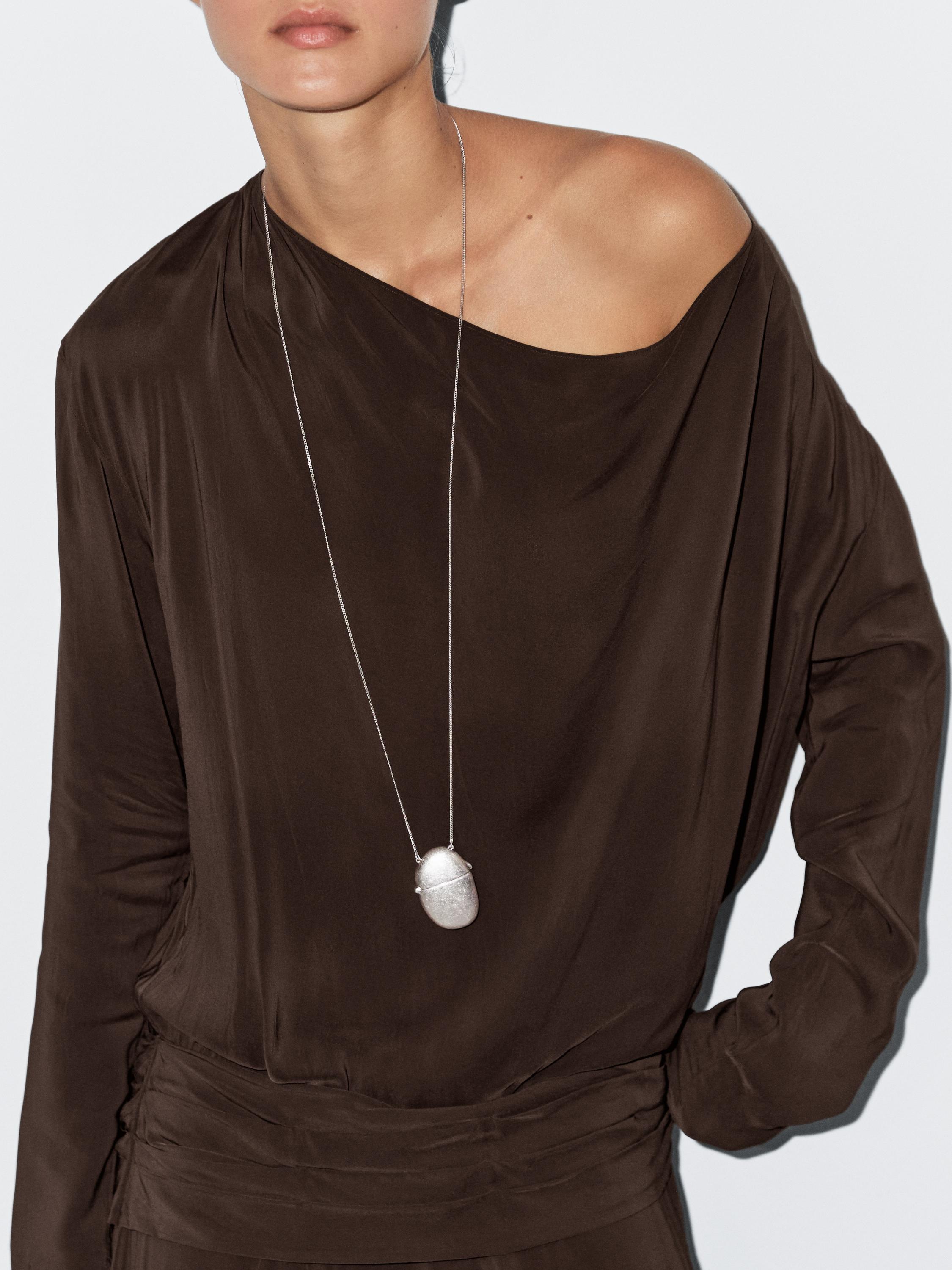 Long flowing dress with draped sash belt