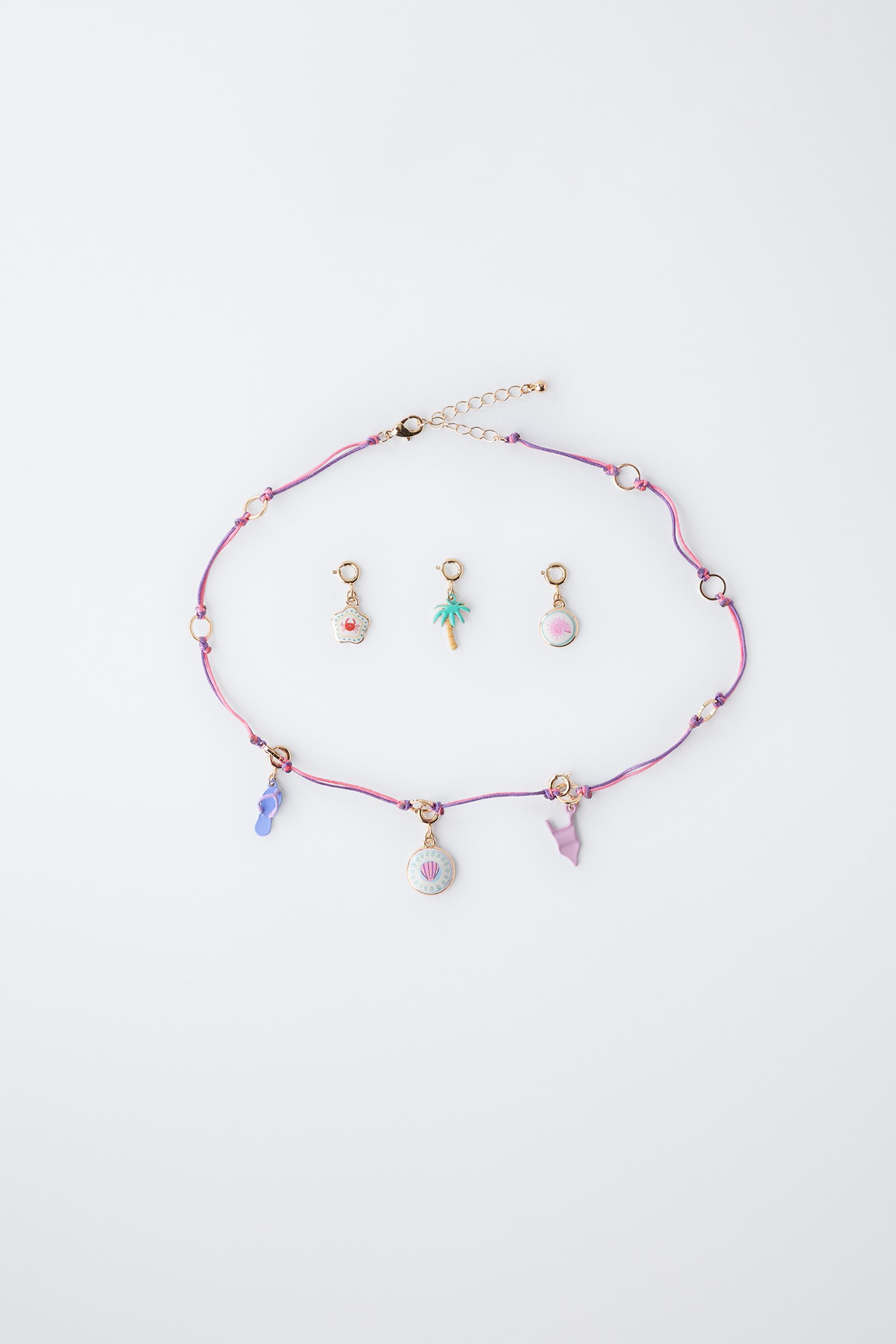 INTERCHANGEABLE MULTI-CHARM NECKLACE