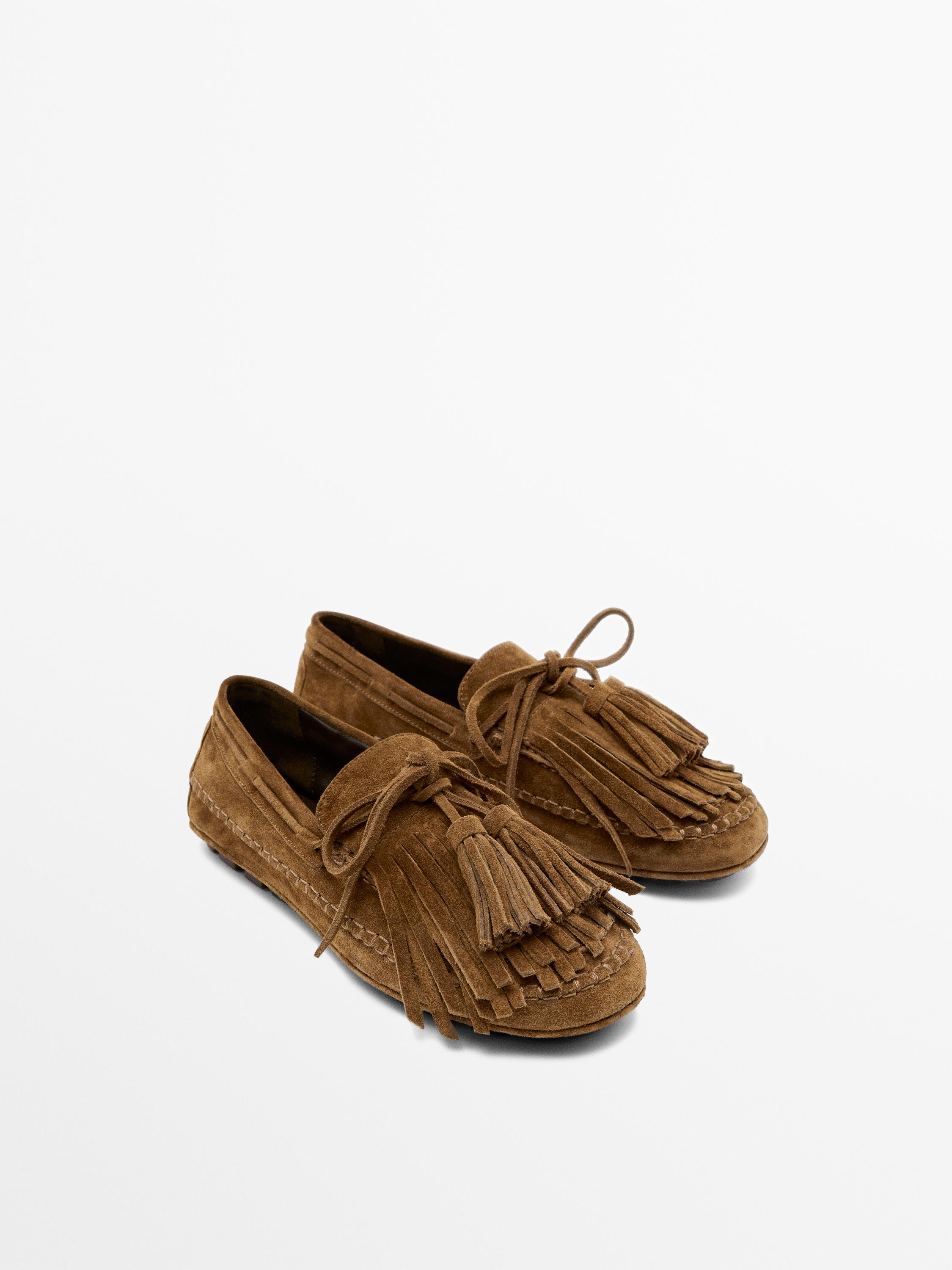 Mocassin à franges et pompons en croûte de cuir
