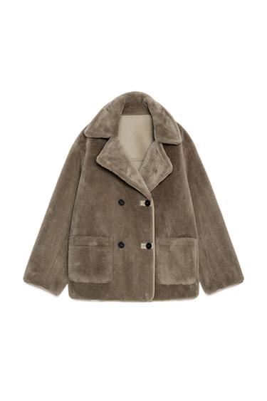 Front view of reversible taupe coat with lapel collar, long sleeves, patch pockets and button fastening.