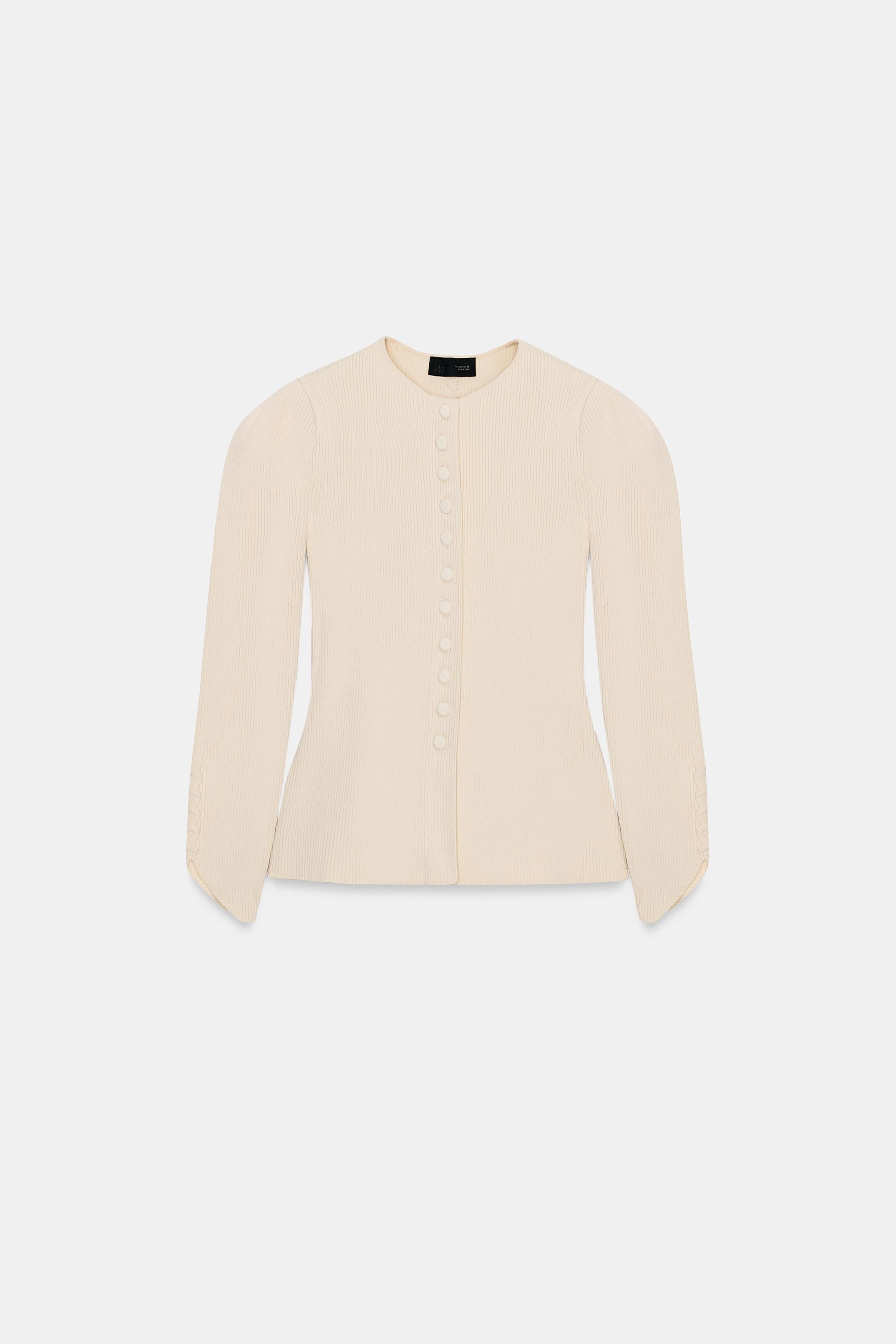 VESTE EN MAILLE À MANCHES BOUFFANTES