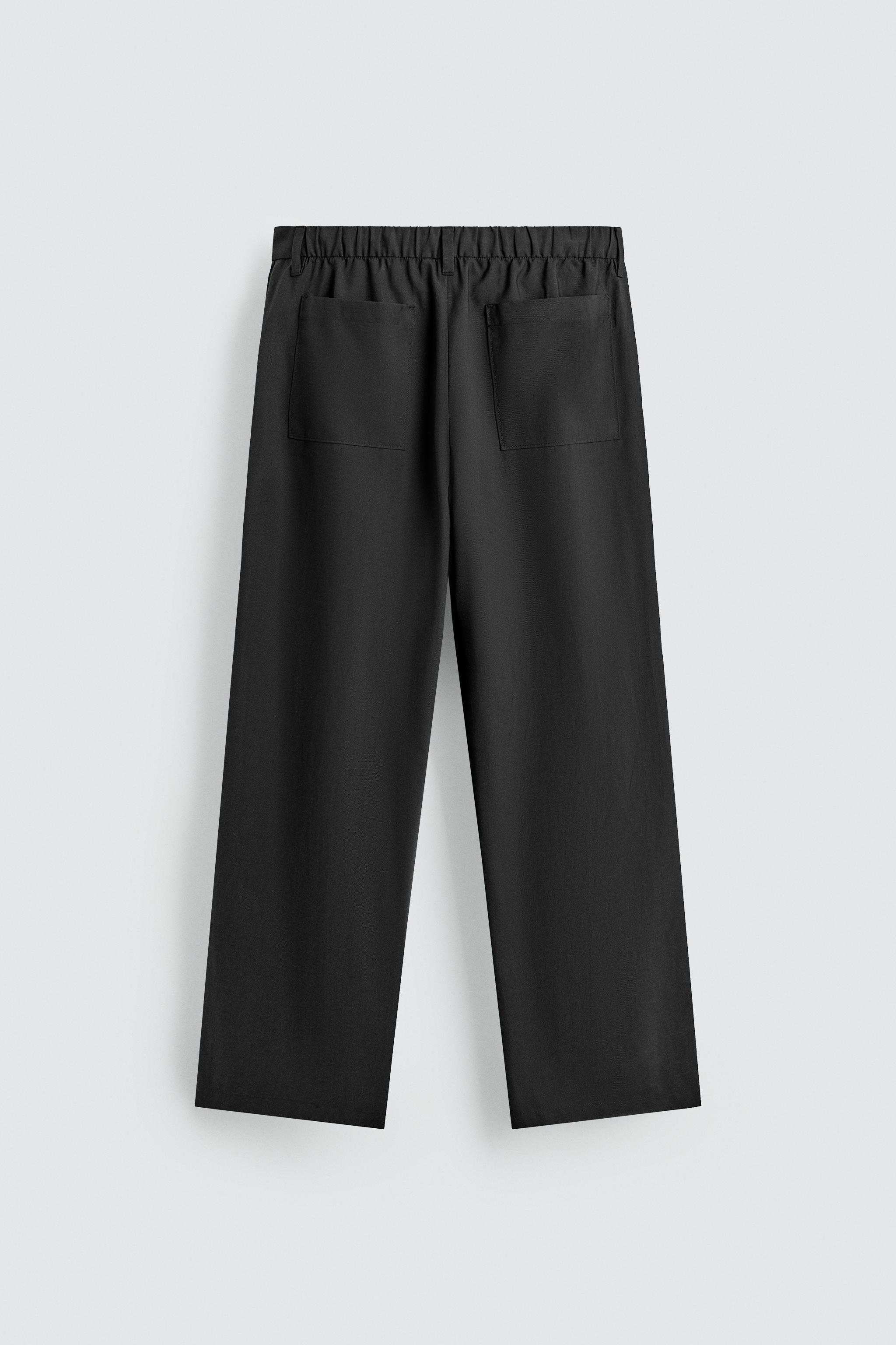 FLOWY PLEATED PANTS