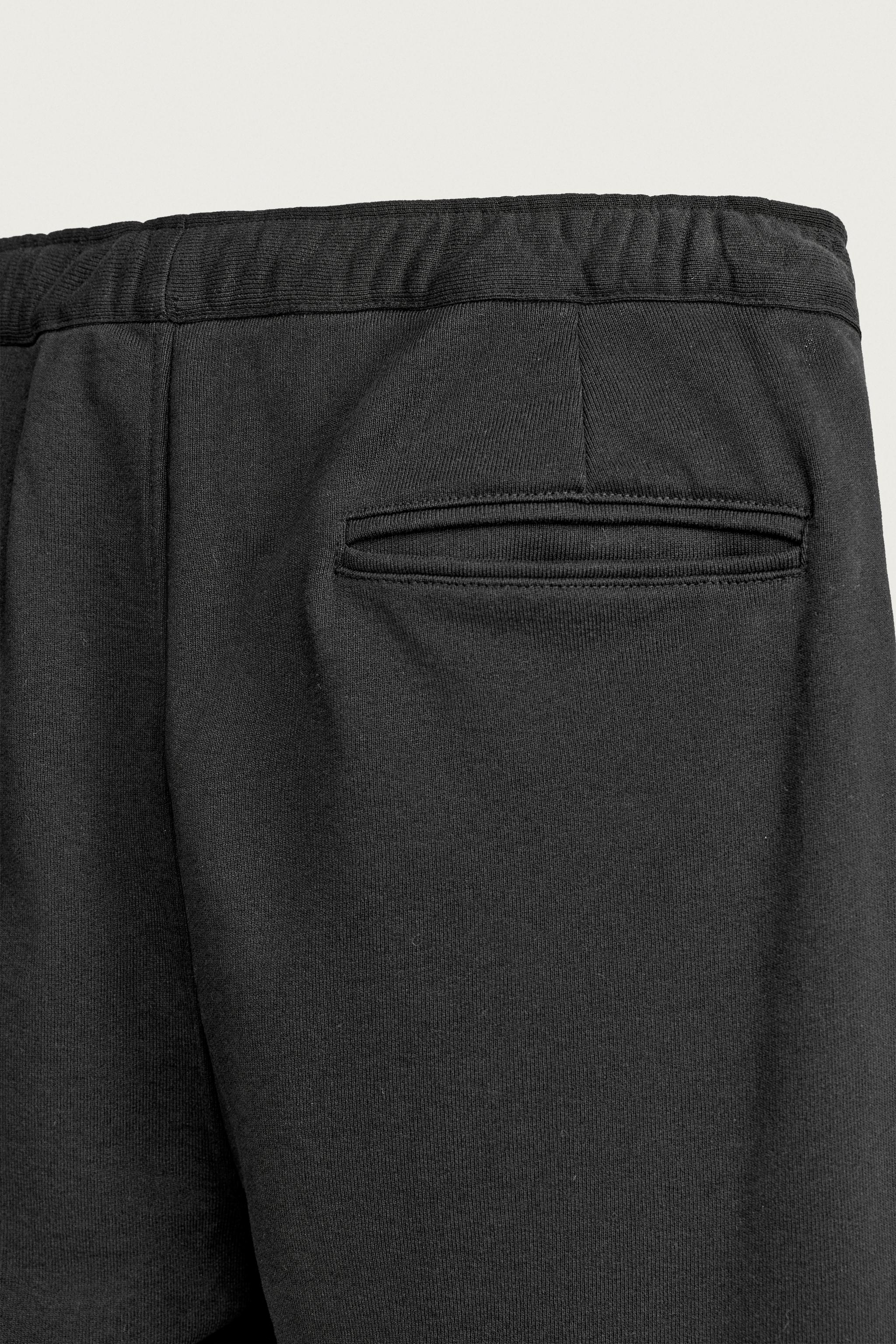 PANTALON DE JOGGING À PLIS LATÉRAUX