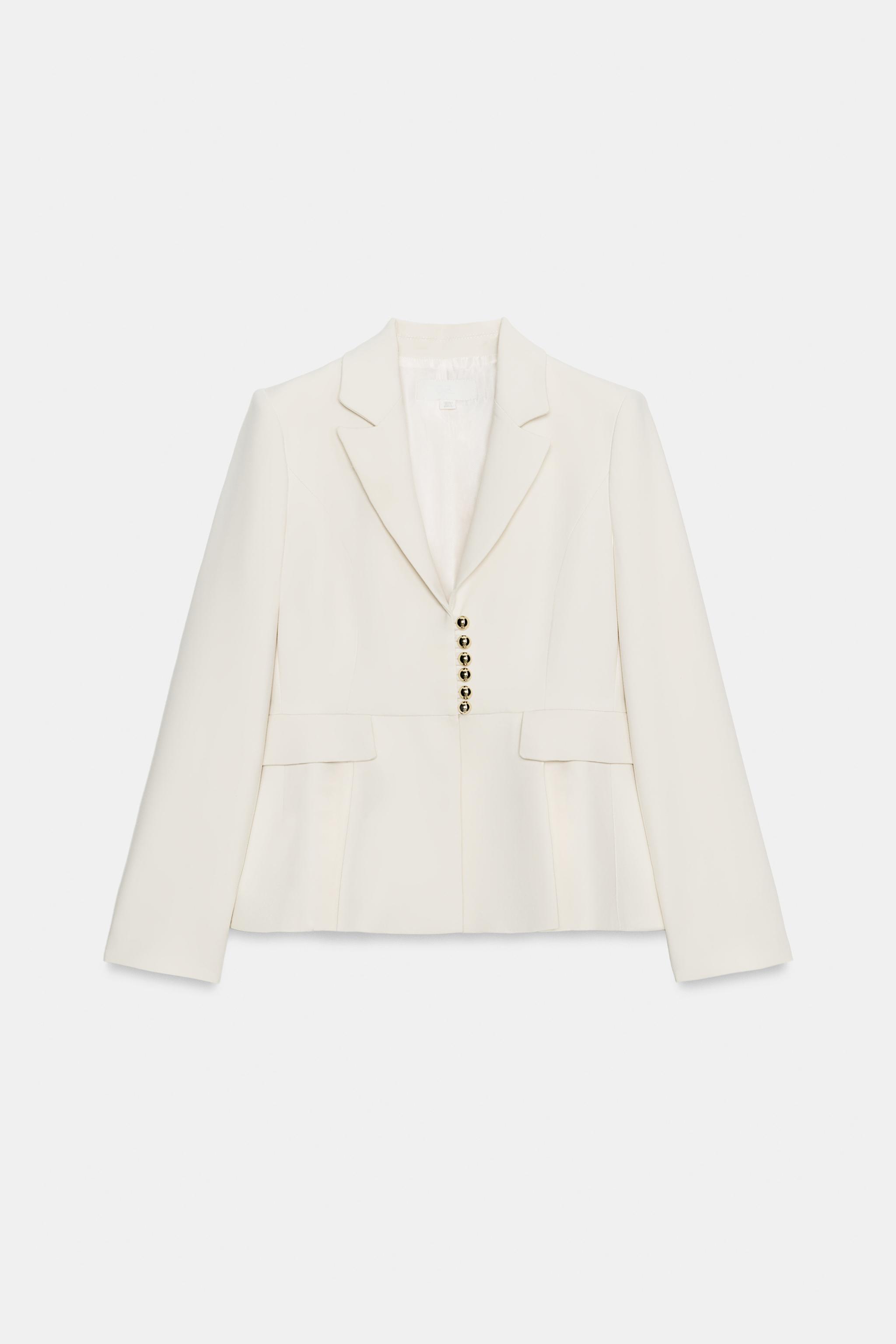 VESTE PÉPLUM À ÉPAULETTES