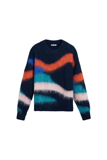 Wool jumper with abstract design in blue, orange, white, and black. Visible label on the neck with text "Zara". White background.