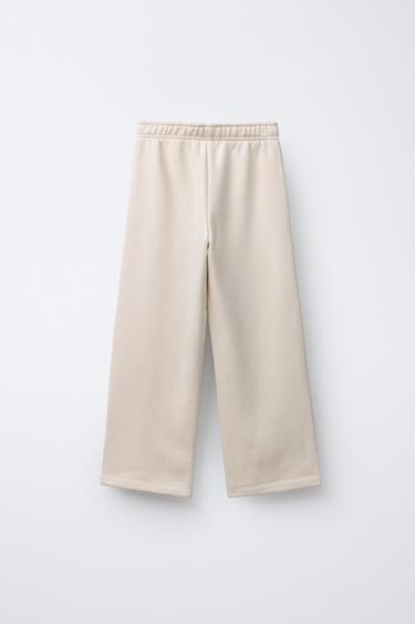 PANTALON EN MOLLETON À JAMBES LARGES - Écru de Zara - Image 1
