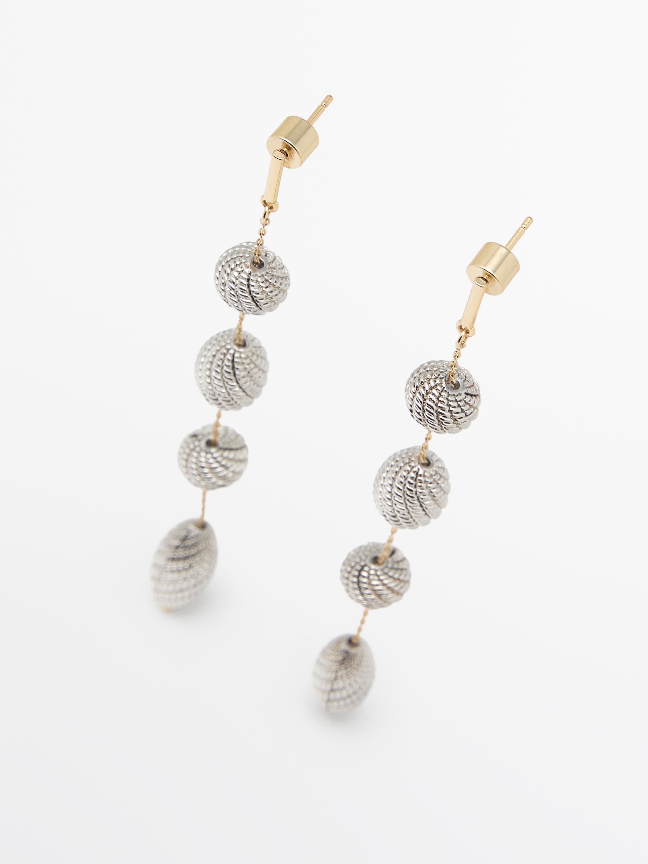 Boucles d’oreilles pendantes pièces texturées
