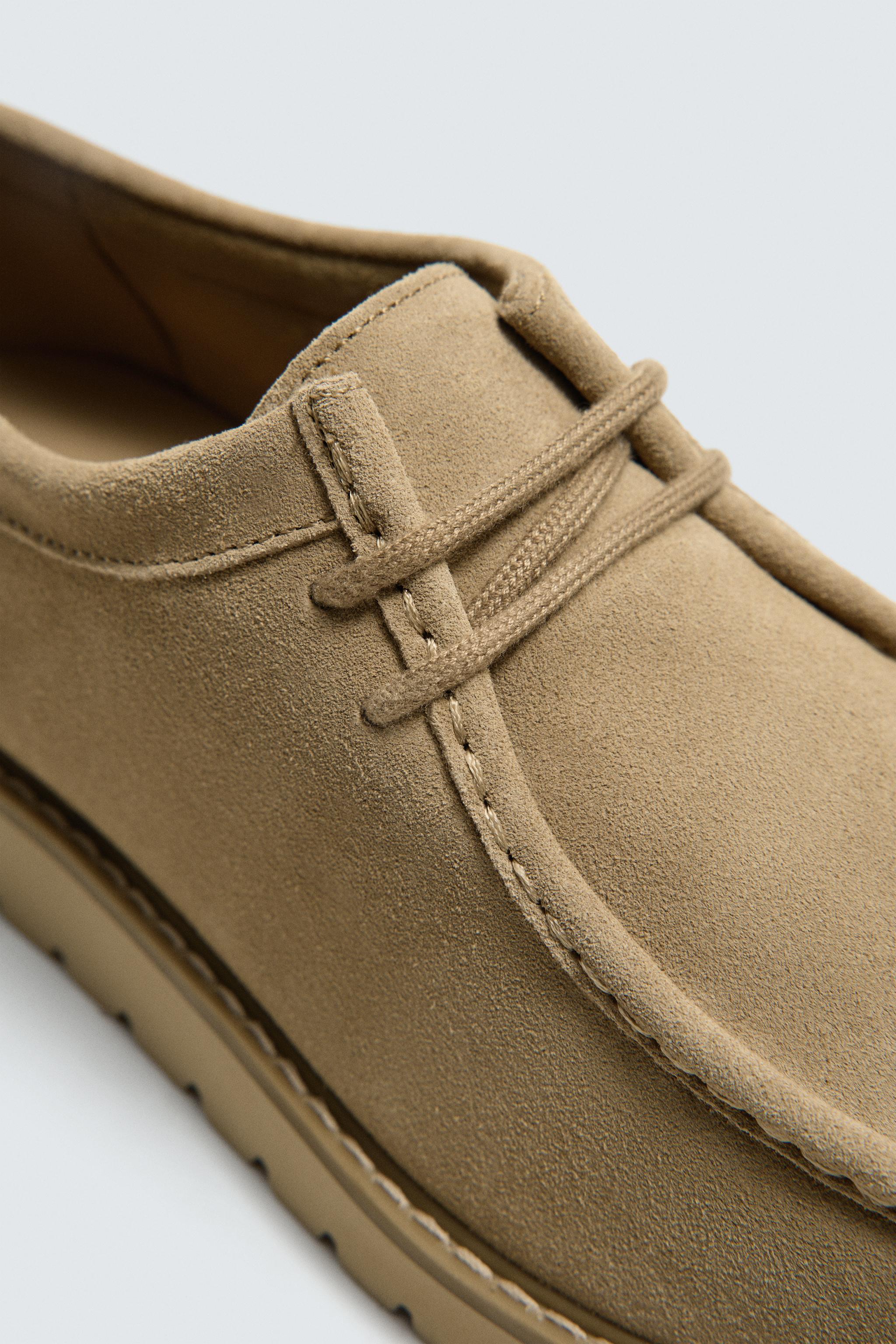 CHAUSSURES EN CUIR BORDÉES