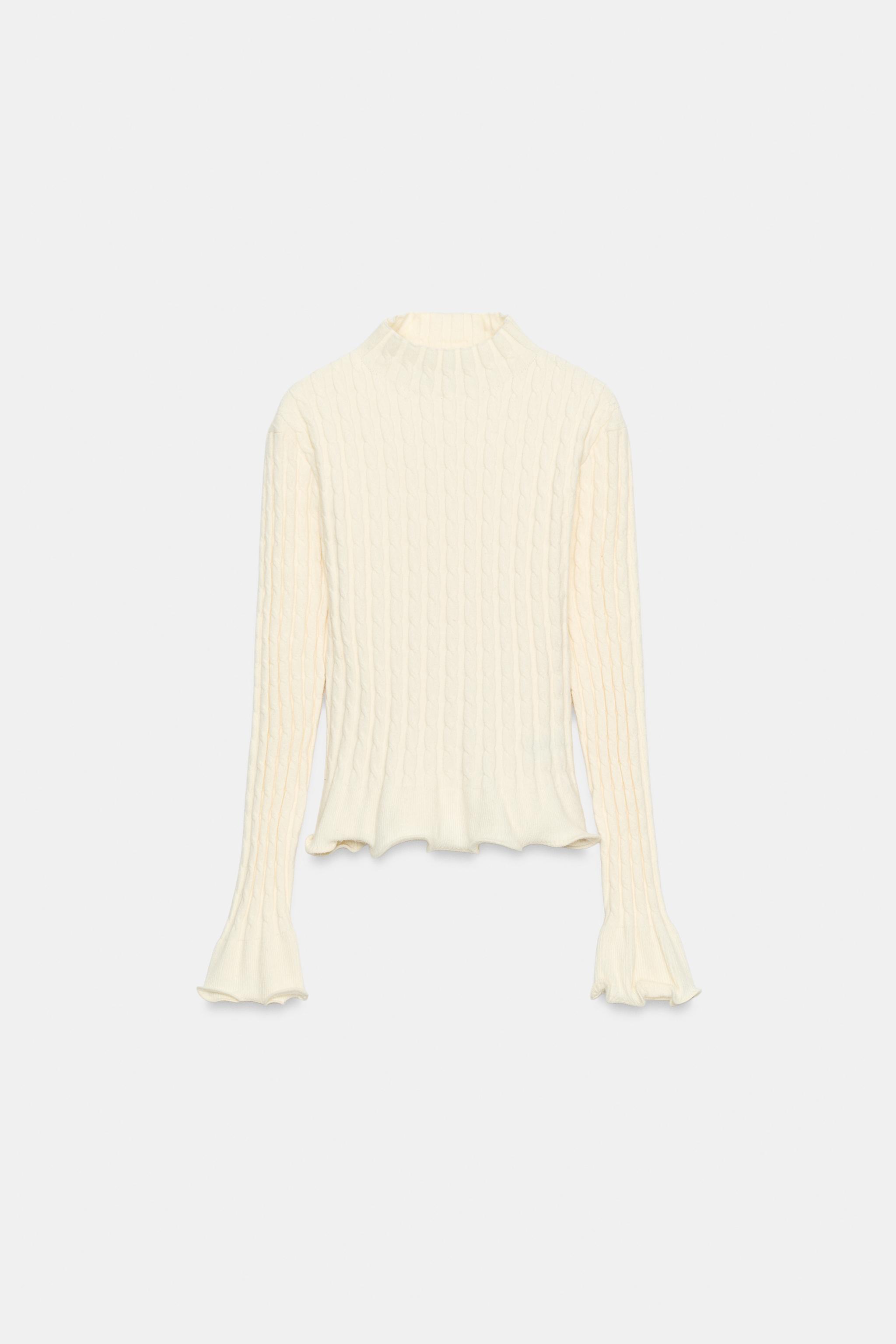 PULL EN MAILLE TORSADÉE À VOLANTS