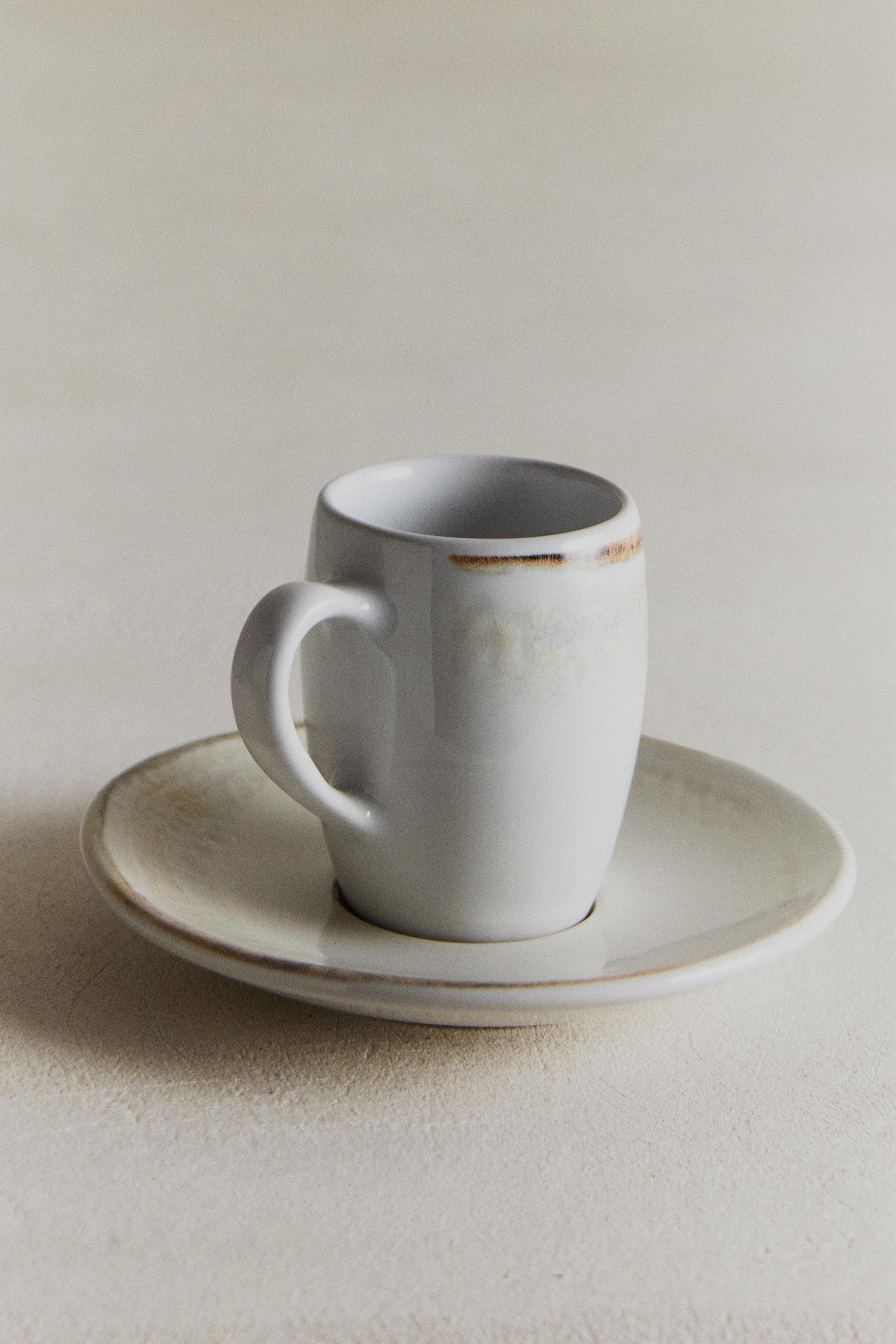 STONEWARE COFFEE CUP AND SAUCER