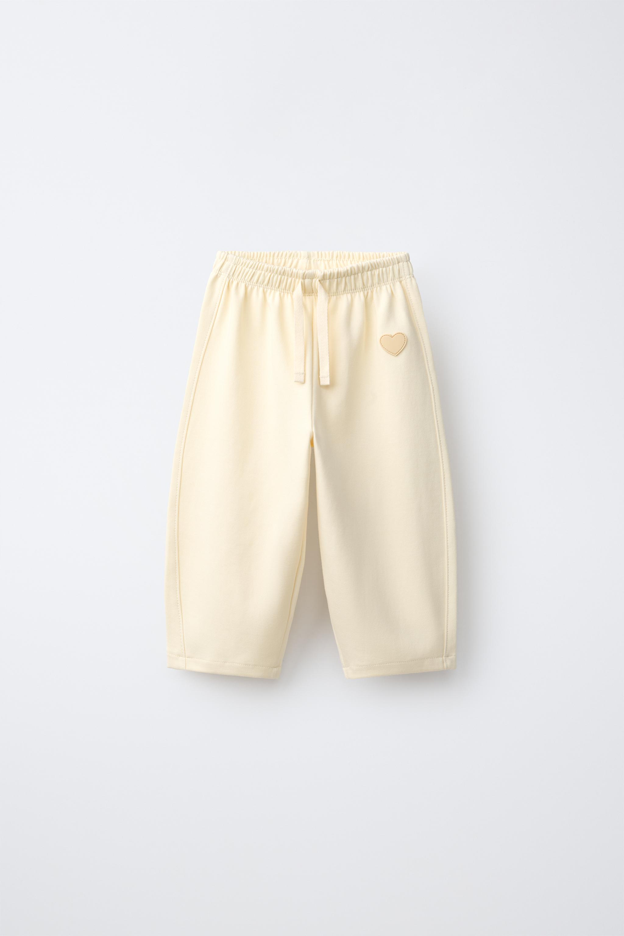 RUBBERIZED HEART INTERLOCK BARREL PANTS — Butter