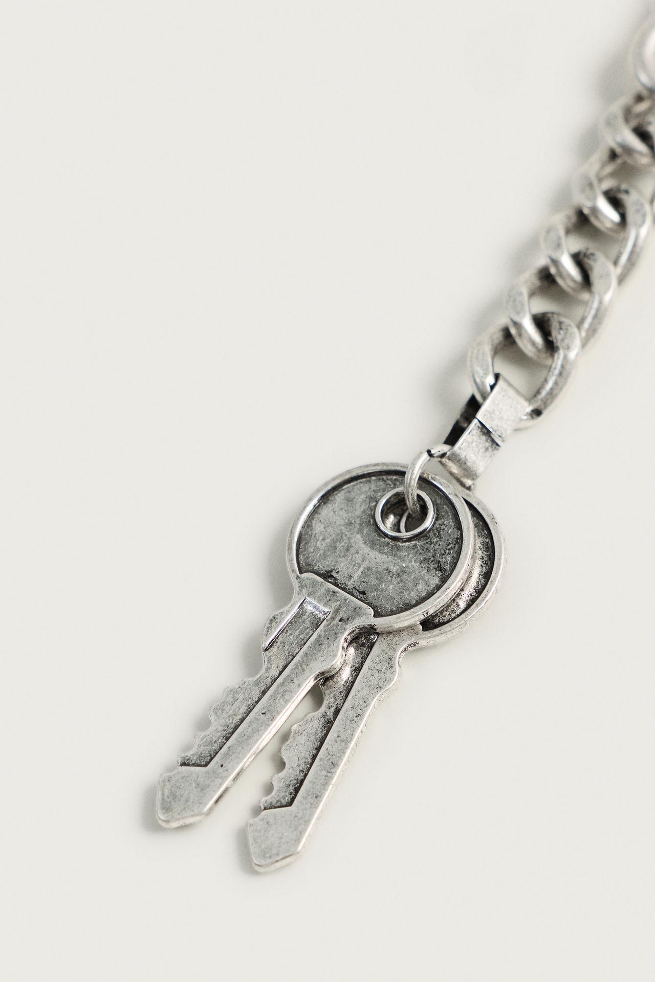 METAL KEY-SHAPED CHARM KEYCHAIN — Silver