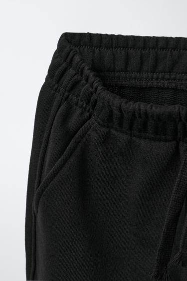 PANTALON EN MOLLETON À JAMBES LARGES ÉTOILES - Noir de Zara - Image 2