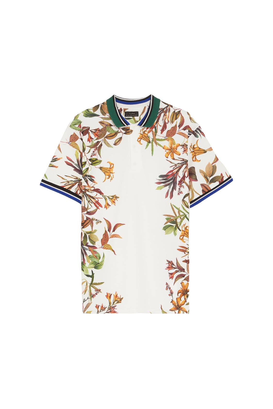 Short-sleeve white polo shirt with a floral print. Collar and cuffs with stripes in green, white, black, and blue on a white background.