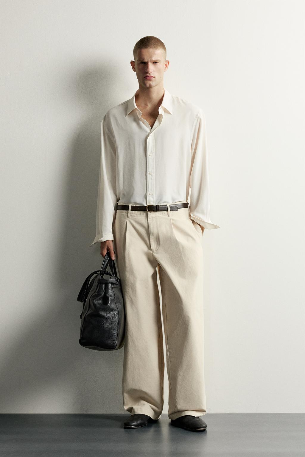 RELAXED FIT PLEATED TROUSERS