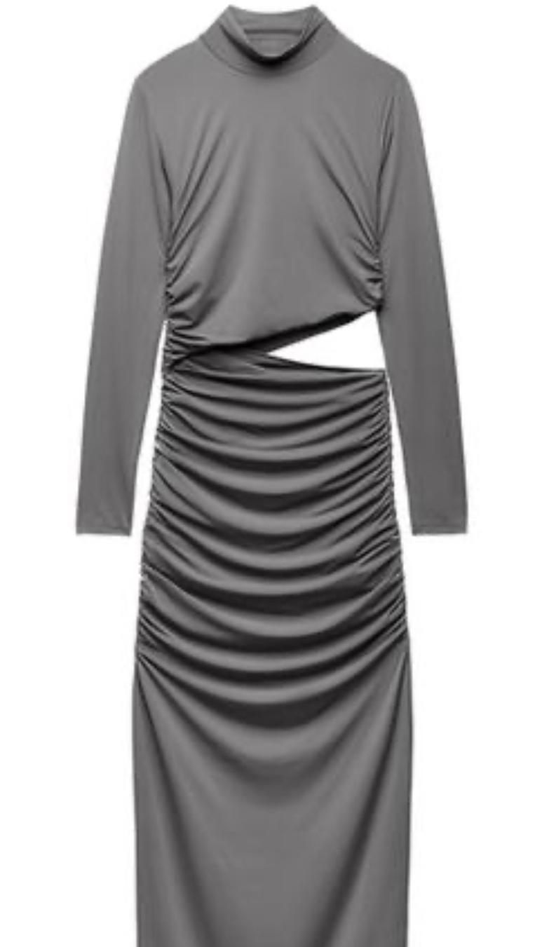 Long-sleeved gray dress with a high neck, waist cutout, and ruched skirt design against a white background.
