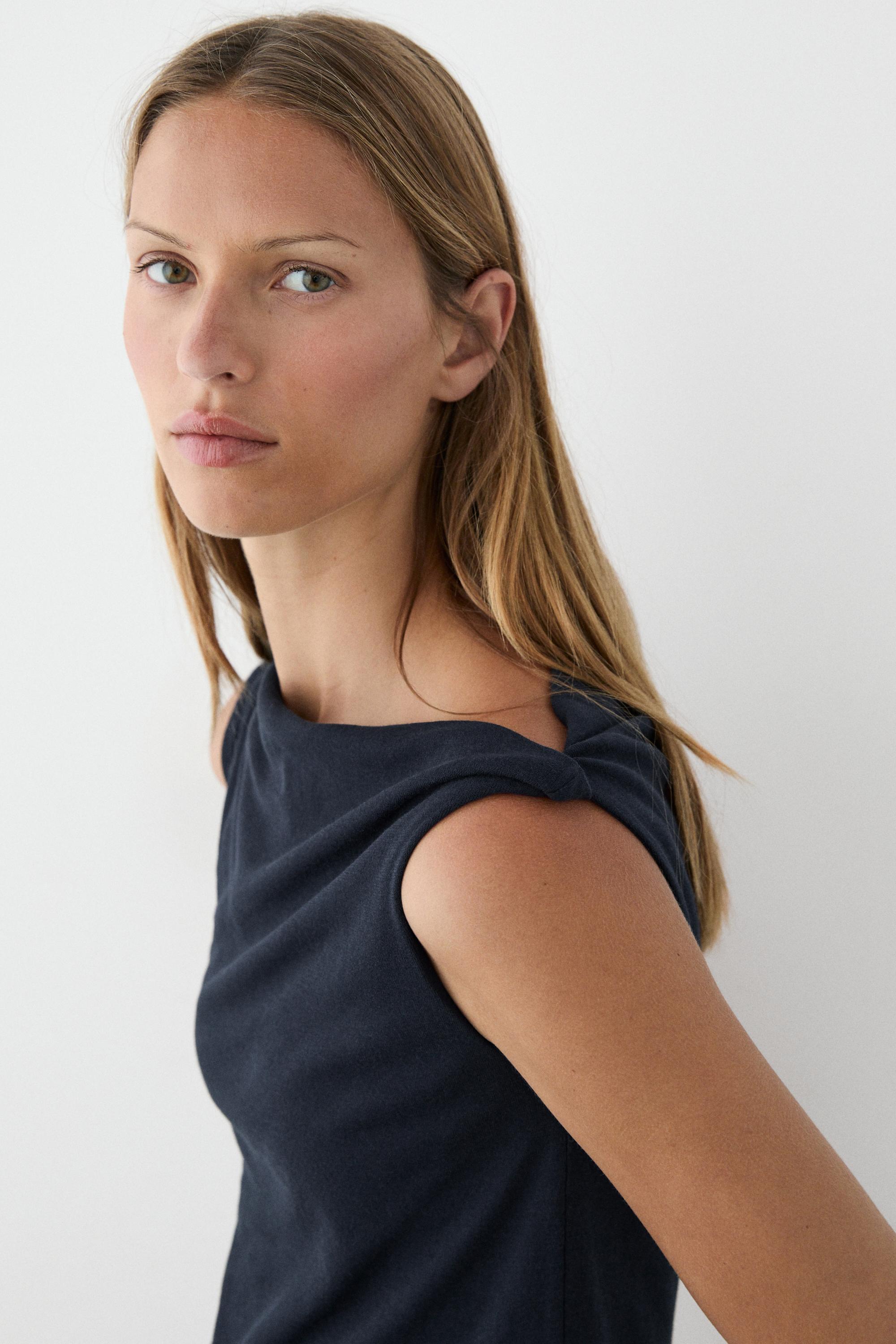 Asymmetric drop sleeve top
