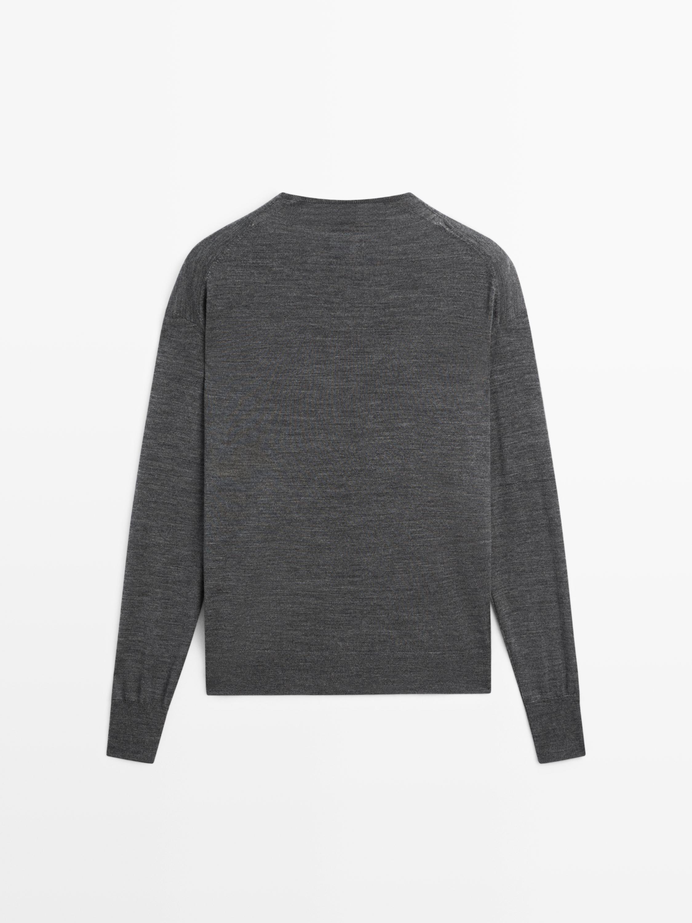 Mock turtleneck cardigan with covered buttons