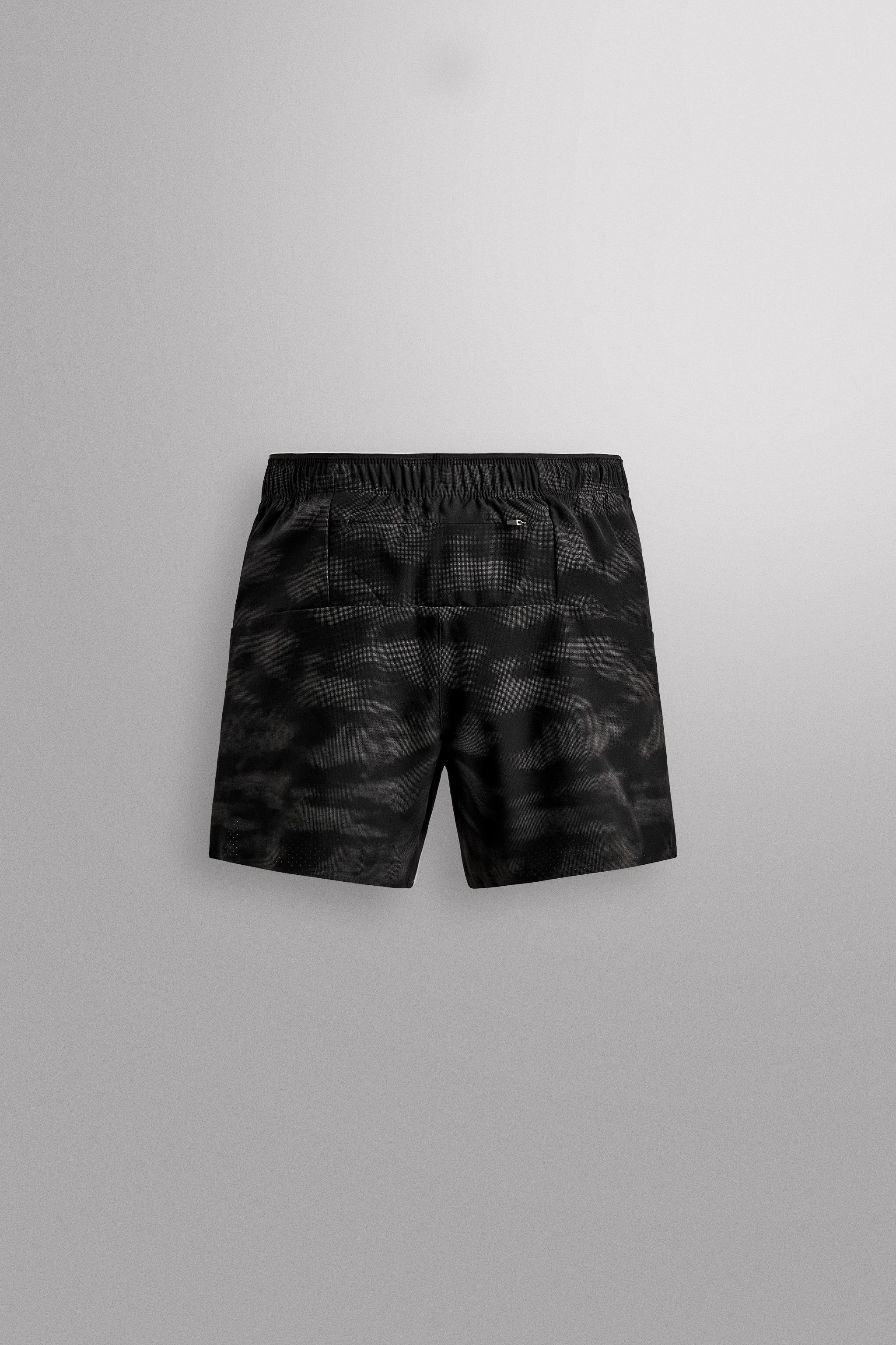 PERFORATED RUNNING SHORTS