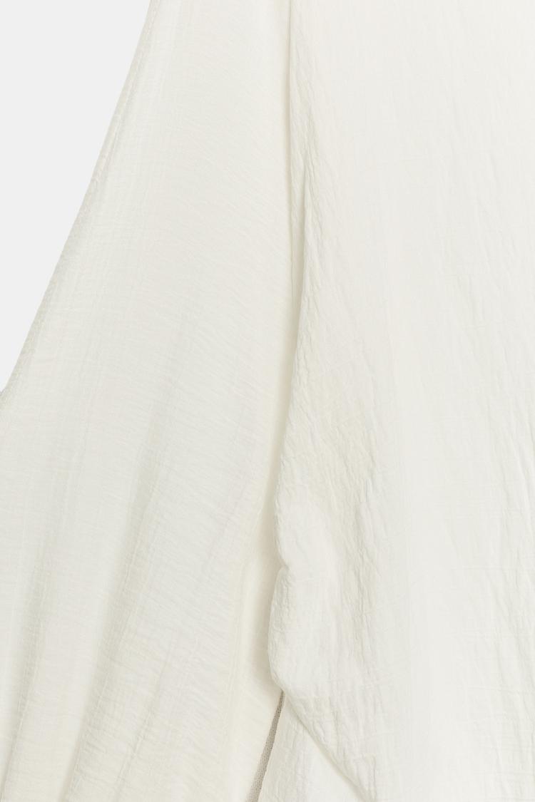 Blusa con aberturas en las mangas 6