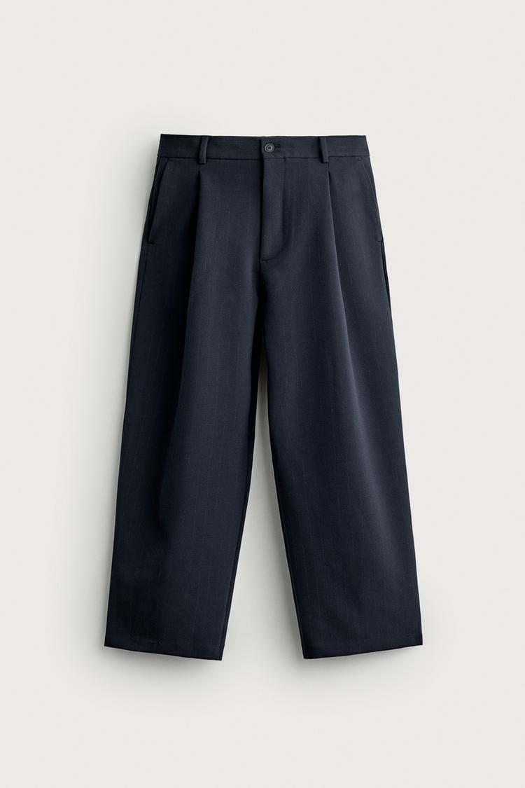Pantalon relaxed fit pliegues