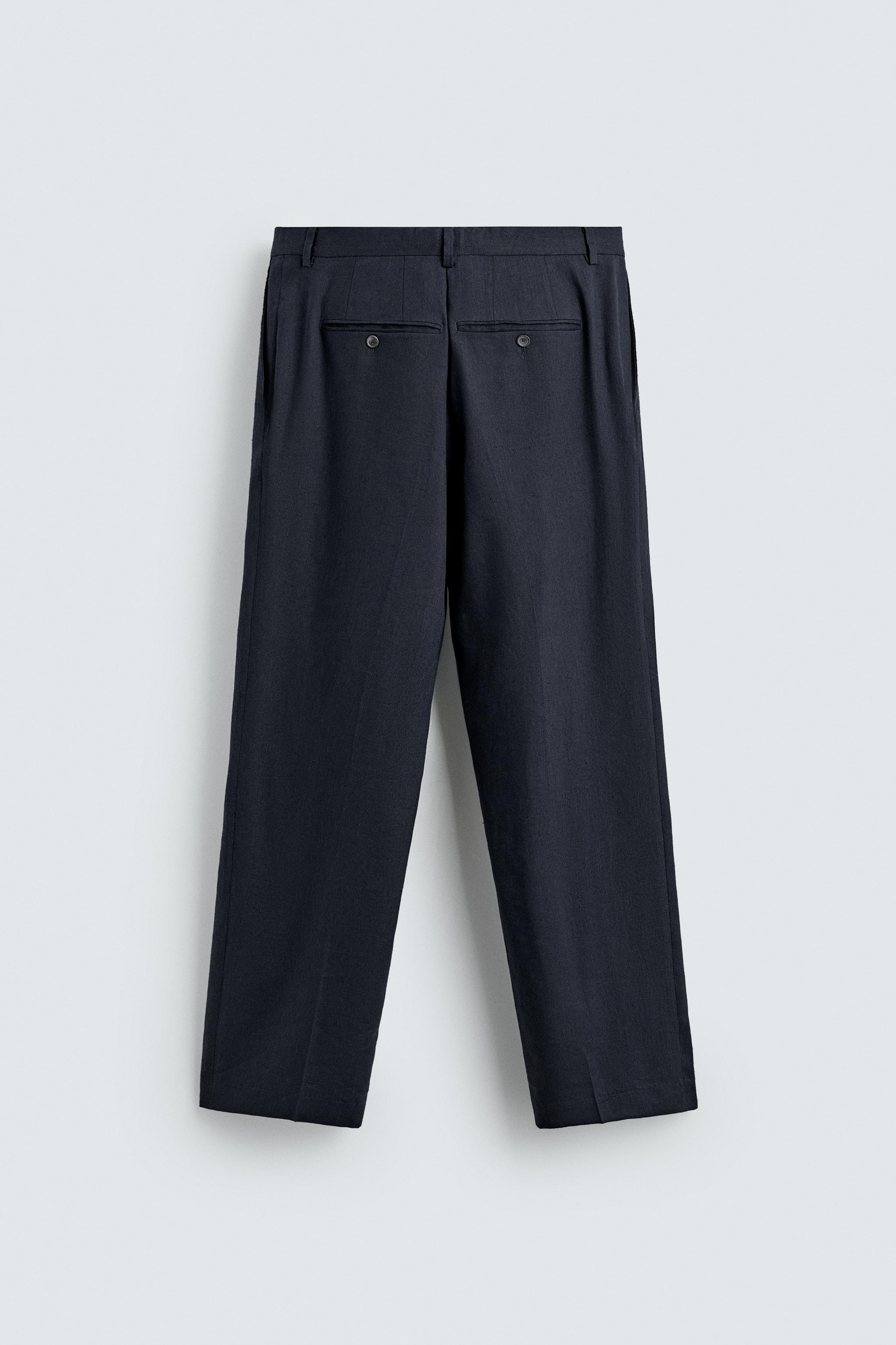 100% WOOL RELAXED FIT PLEATED PANTS